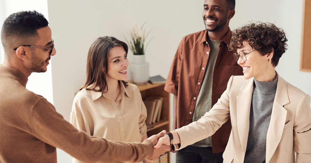 People shaking hands in a workplace enviromment