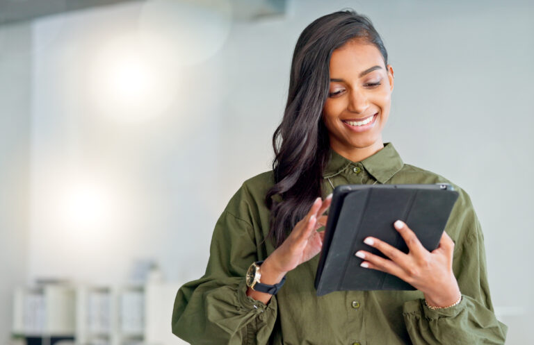 Business woman typing an email, browsing the internet and searching for ideas on a tablet at work. Female corporate professional, expert and designer scrolling on social media or reading a blog.