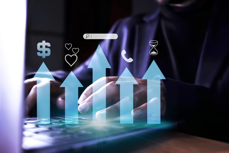 Person's hands on laptop with graphics of growth, symbols of money, love, and time.