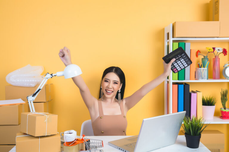 business owner working at home office packaging on background.