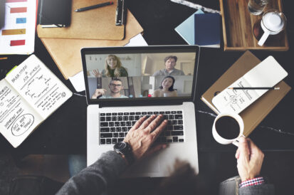 Businessman in a video conference call while working from home during the coronavirus pandemic