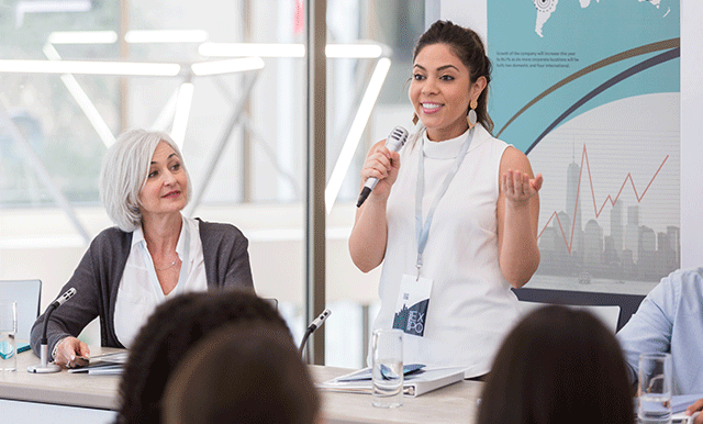 woman speaking on panel