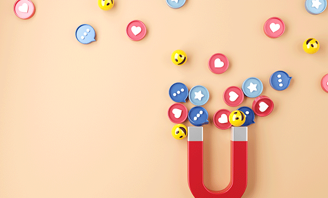 a magnet with emojis being attracted to it