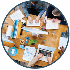 circular photo people working at a desk