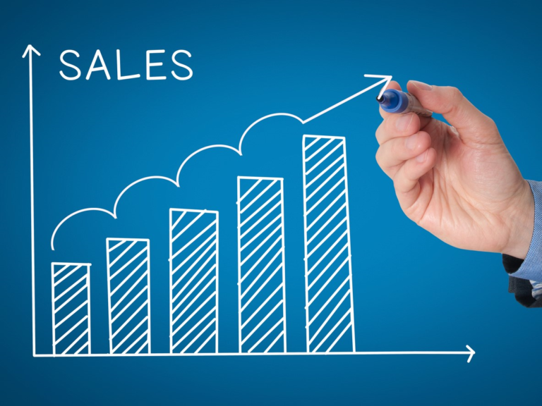 hand drawing a sales chart