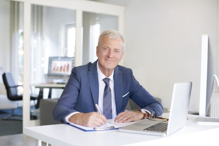 A business man who's looking at the camera